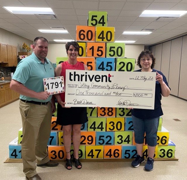 Pictured are Bryce Kelley (Thrivent), OraLee Dittrich (Thrivent), and Vicky Calmes (CCL Director) giving and receiving a donation check of $1,000 to the CCL.